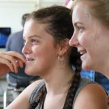 Two computer science students smiling 